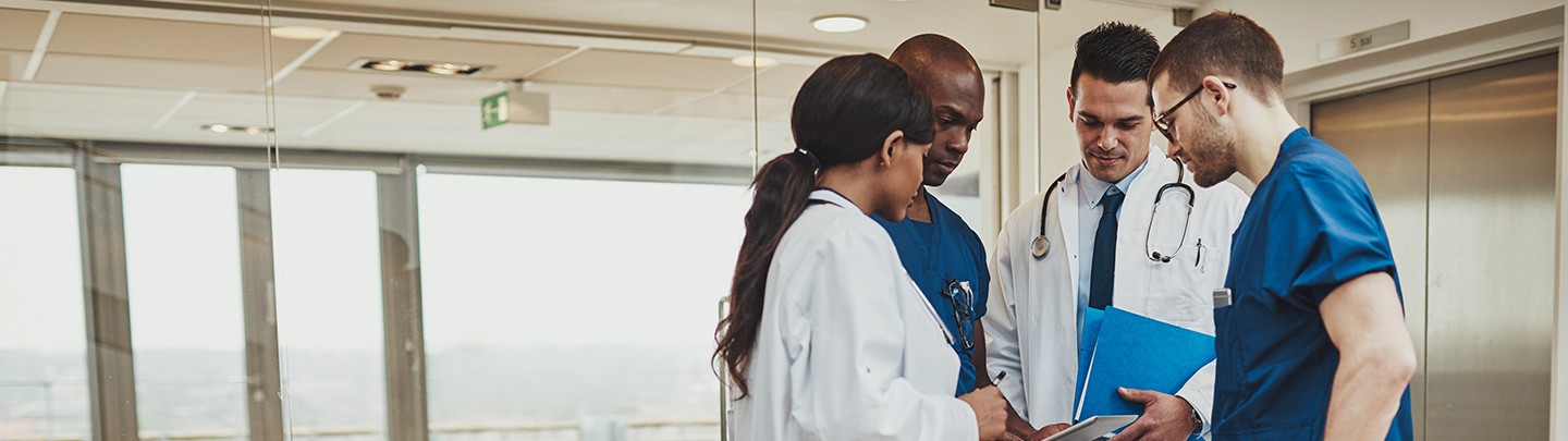 Group of physicians and employees talking